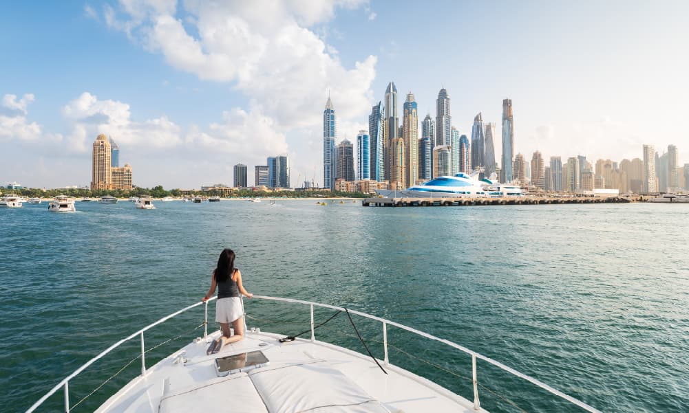 Luxury yacht cruising past Atlantis The Palm in Dubai