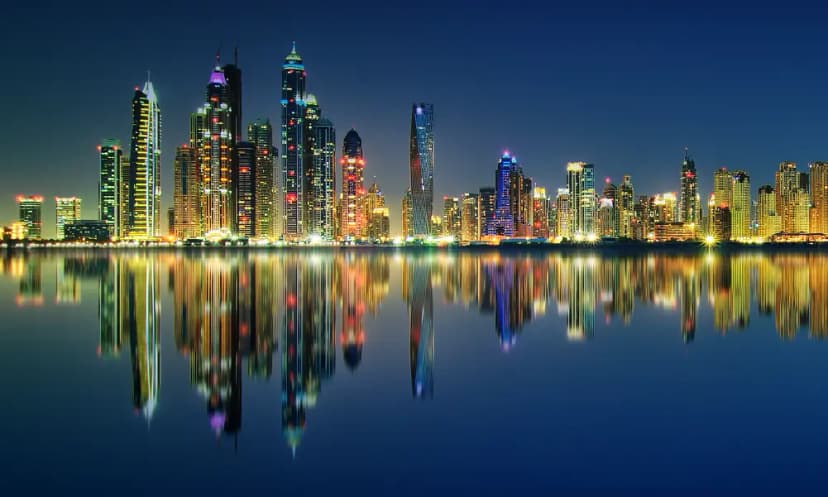 Luxury yacht cruising along Dubai Marina skyline