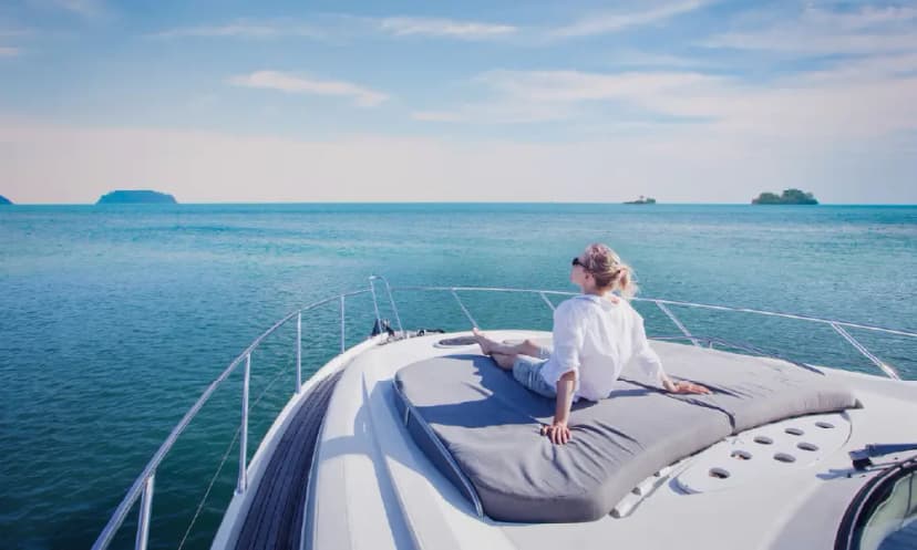 Couple relaxing on the deck of a private luxury yacht in Dubai
