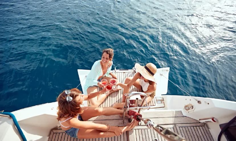 Travelers enjoying a shared yacht tour in Dubai with group seating
