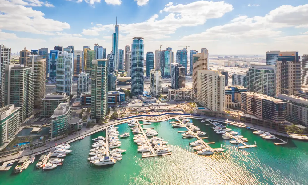 Luxury yacht anchored in Dubai Marina at sunset